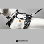 Black Brahma M heavy-duty style Safety Connector shown connected to a martingale collar and a leash. The leash is connected to a body harness on a mannequin with 'bold lead designs' branding.