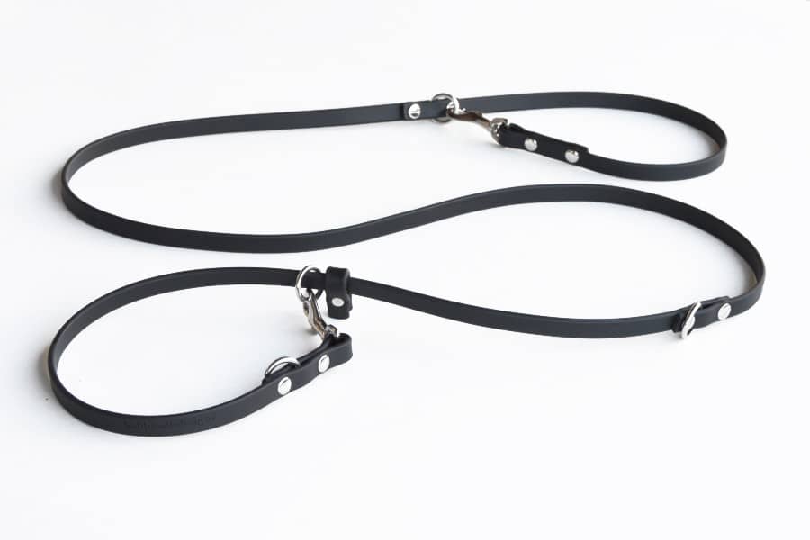 Black 8-wayLead in medium half-inch size showing "dog end" clipped to O-ring to make a slip--collar on white background