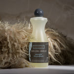 Eucalan bottle with a label on a textured surface