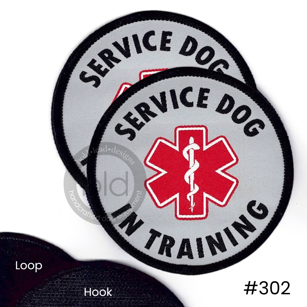 Two 'Service Dog in Training' patches with a red star of life symbol on a white background.