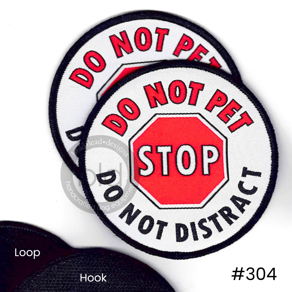 Two patches with 'Do Not Pet', 'Stop', and 'Do Not Distract' text on a white background.