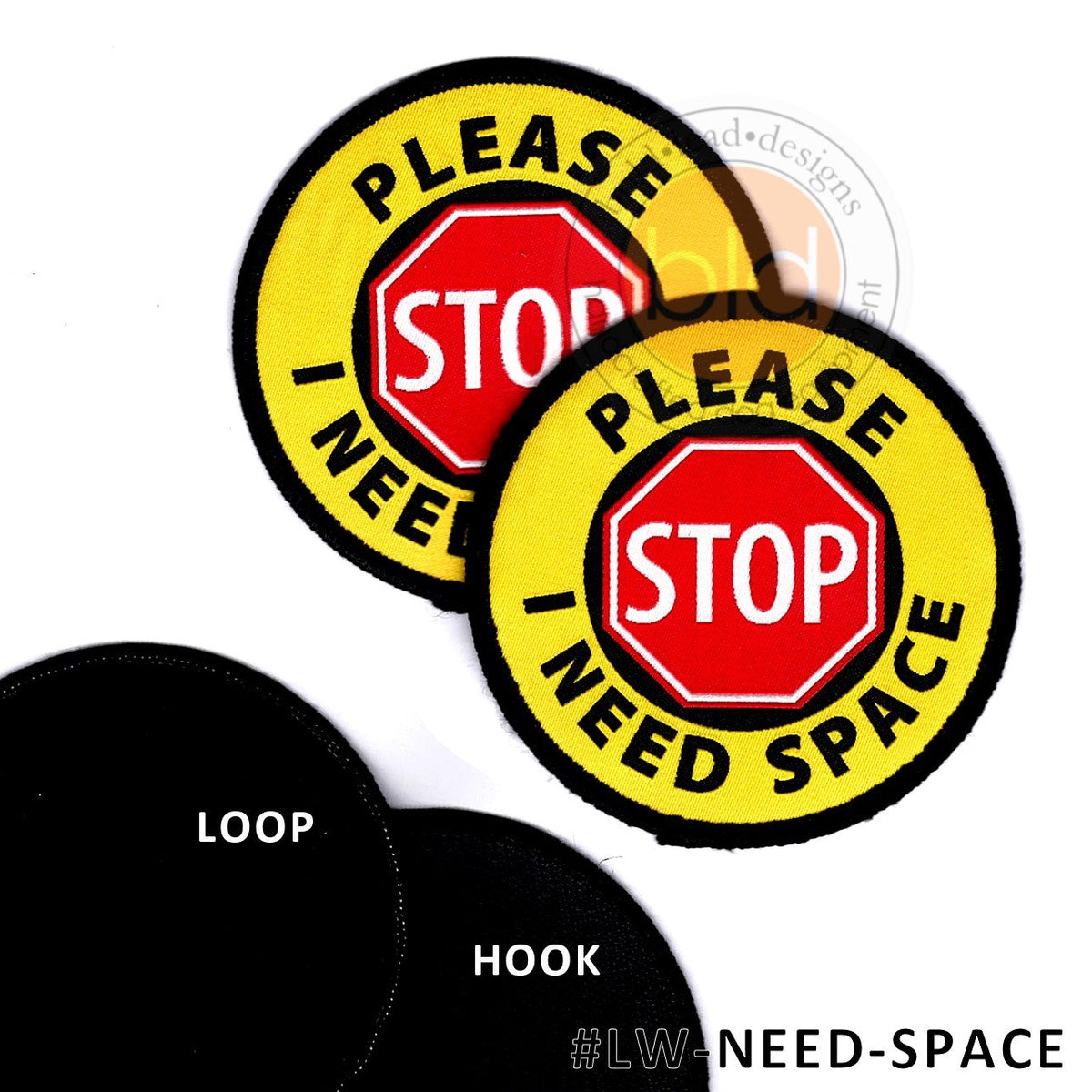 Two patches with red stop signs and yellow circles with text Please / I need Space white background.