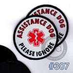 Assistance dog patch with red star of life symbol and text 'Please Ignore'  leash wraps with loop and hook options on a white background.