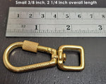 Small 3/8 inch size locking carabiner next to ruler for scale