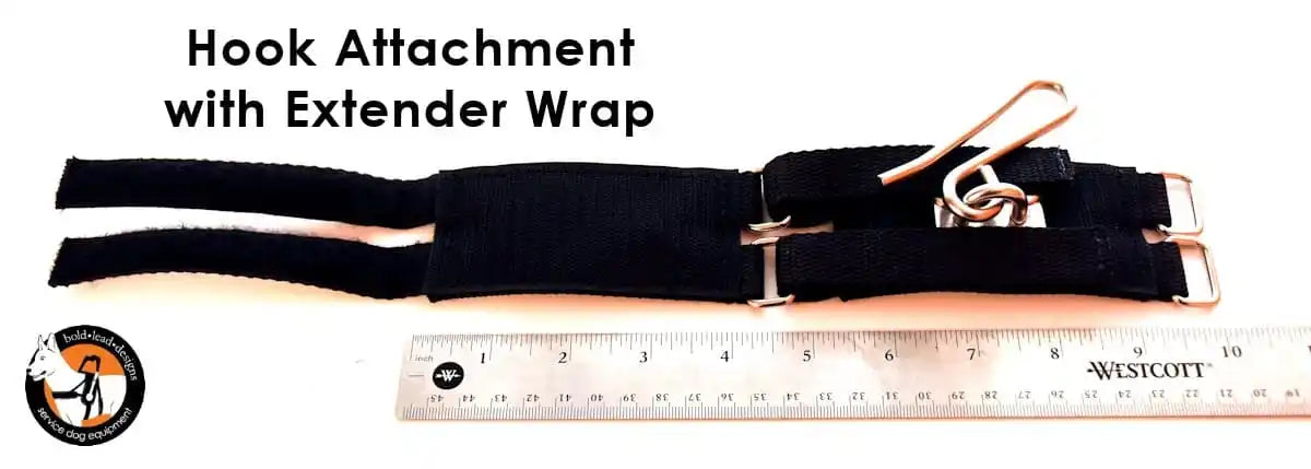 Hook attachment with extender wrap on a white background with a ruler for scale.