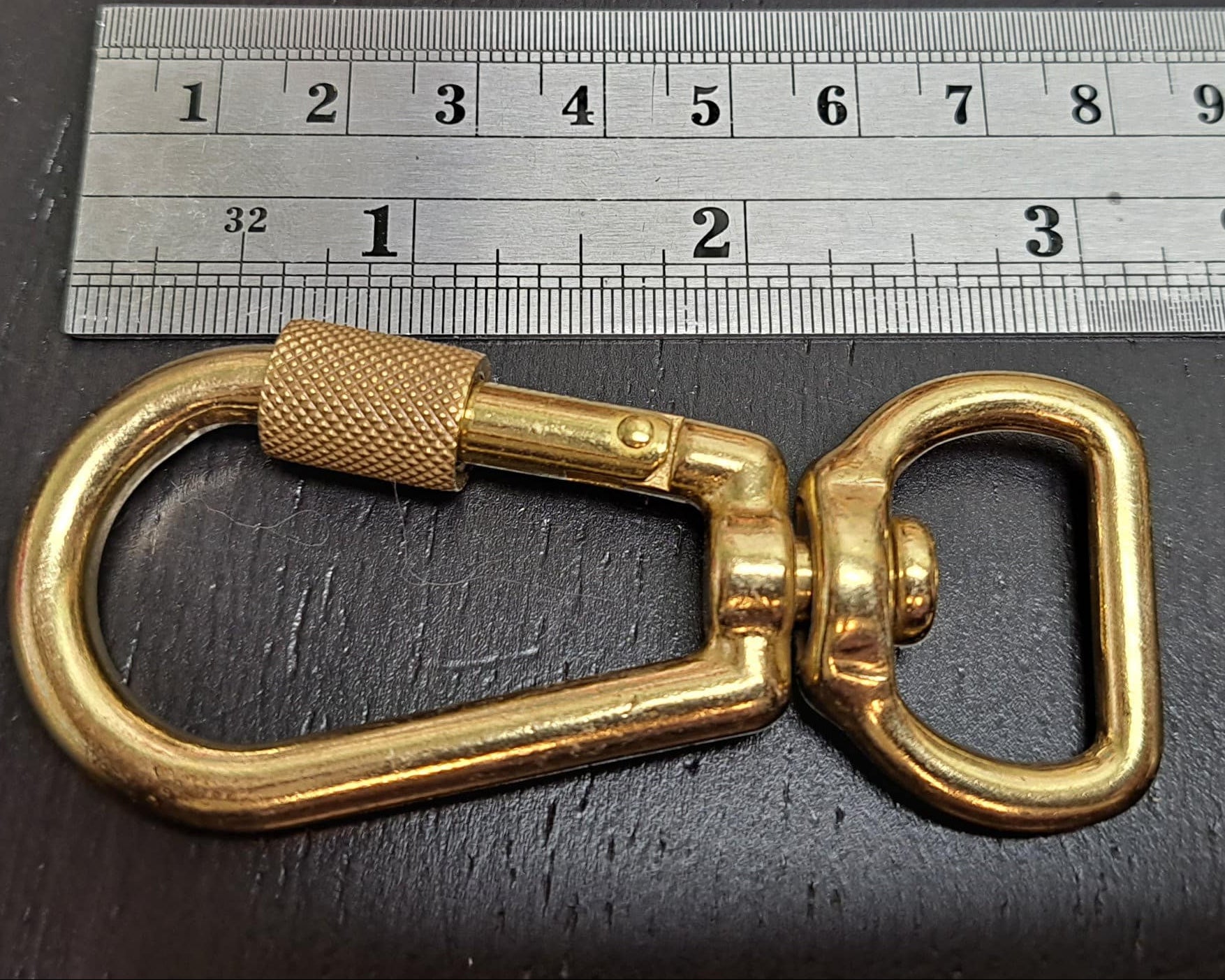 XL 3/4 inch size locking carabiner next to ruler for scale