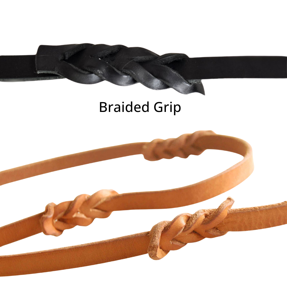 Black and brown leather leashes with braided grips on a white background