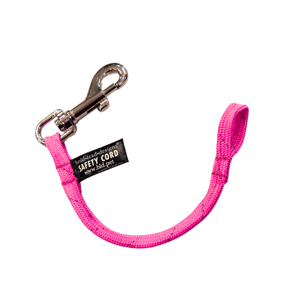 reflective neon pink safety cord on white background