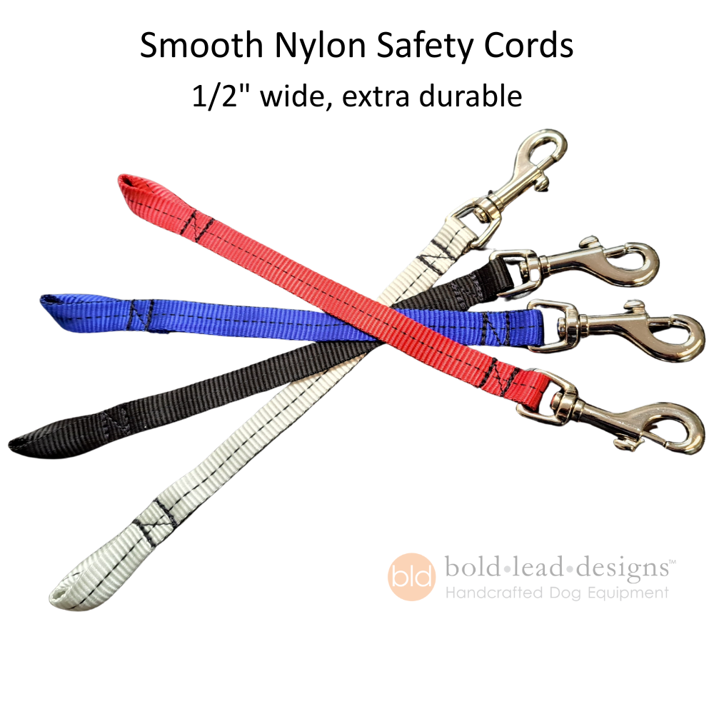 Three smooth nylon safety cords with silver hooks on a white background, featuring text about width and durability.